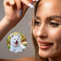 Thumbnail for Family Photo Bracelet featuring a woman's hand holding a pendant with a dog photo, symbolizing cherished memories.