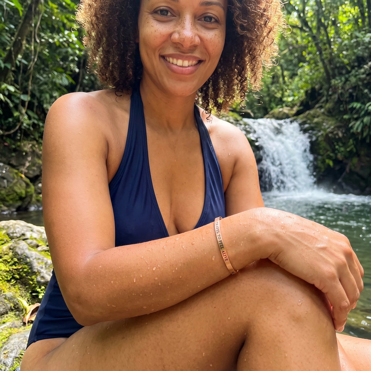 Travel To Feel Alive bracelet in rose gold worn by the water | SKU: ttfa-rg