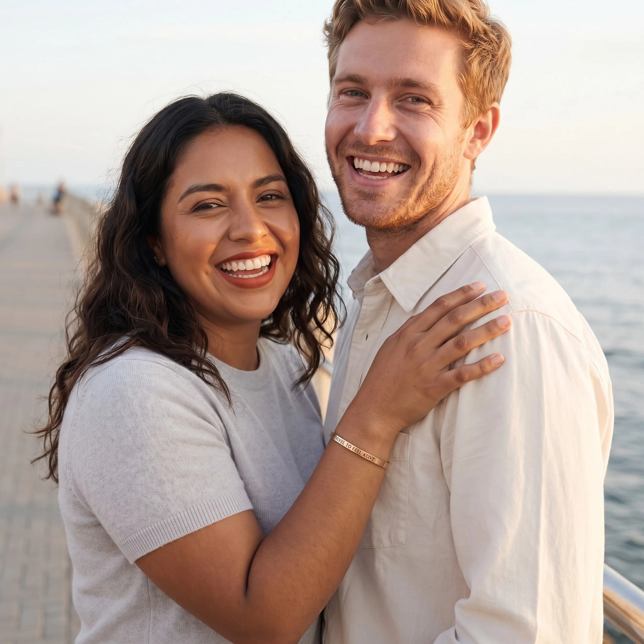 Couple moment, she wears the Travel To Feel Alive bracelet in rose gold | SKU: ttfa-rg